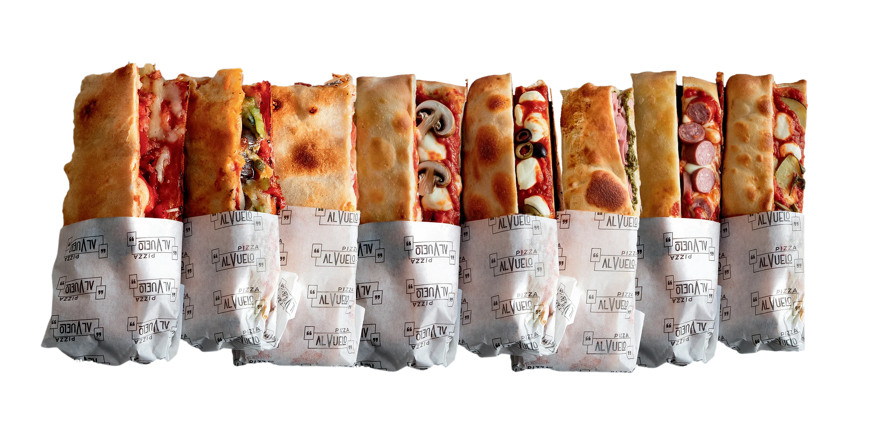 Ocho pizzette dobladas en fila, cada una envuelta hasta la mitad en el papel con el logo de Pizza al Vuelo.